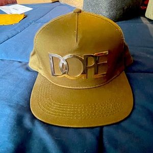 “DOPE" Men’s Green and Gold Metal Lettering Snapback Hat.